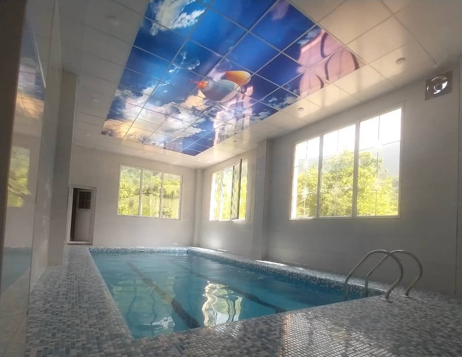 اجاره ویلای جنگلی با استخر سرپوشیده آبگرم در قلعه رودخان