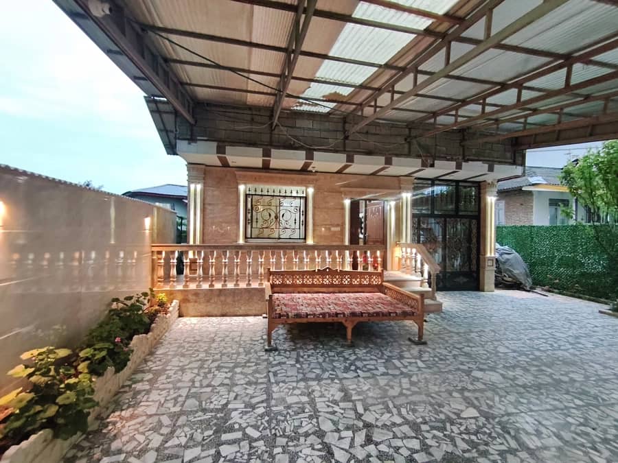 منزل ویلایی در گیسوم - وزمه بیجار اسالم  نما ساختمان و حیاط 